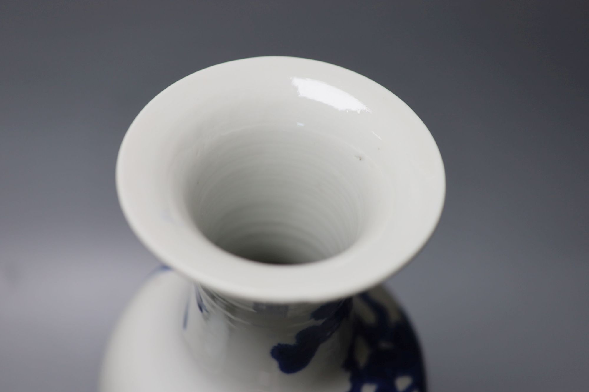 A Chinese blue and white vase, Kangxi mark, c.1900, 36cm and a similar bowl, Qianlong seal mark, early 20th century, 18.5cm